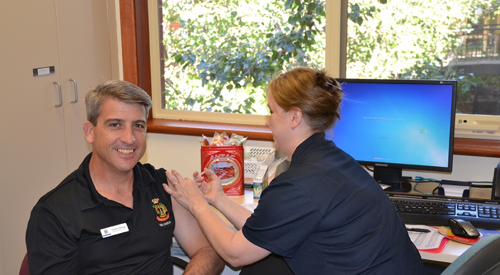 CEO Nathan Klinge receiving his Flu vaccination